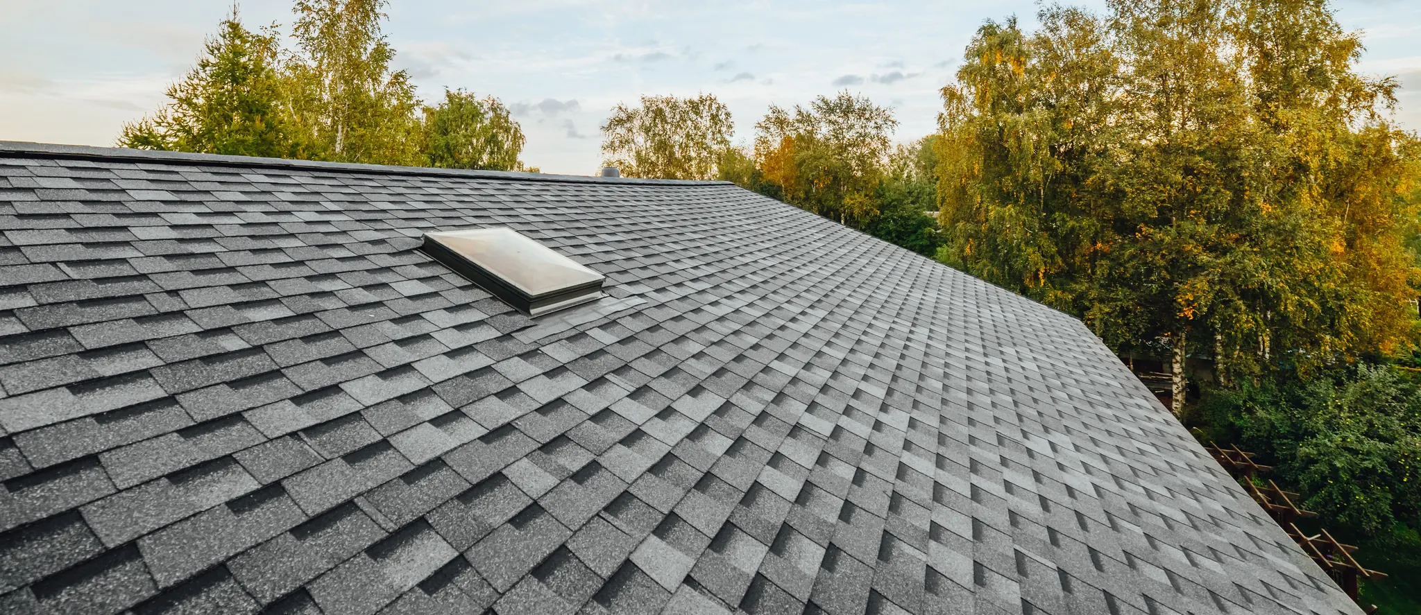 New architectural shingle roof with a skylight on a Maryland home